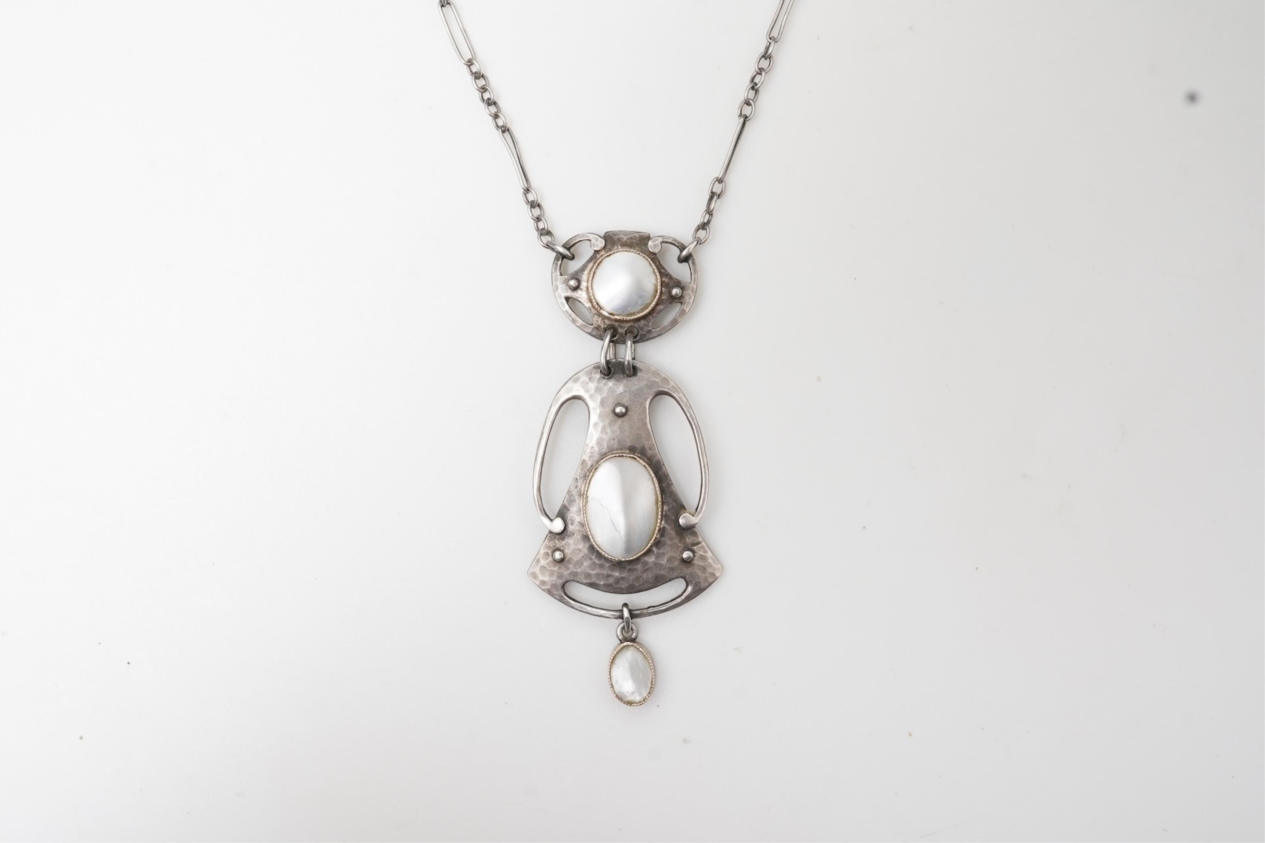 Murrle, Bennett & Co., an Arts & Crafts silver and mother of pearl pendant, circa 1900